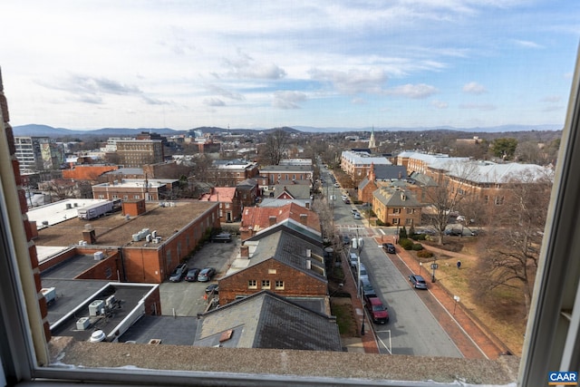 property's view of city featuring a mountain view