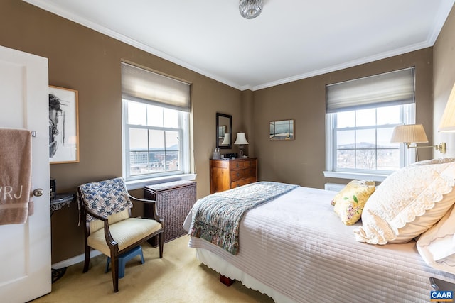 bedroom with ornamental molding, carpet, baseboards, and multiple windows