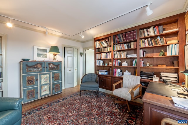 interior space with track lighting and wood finished floors