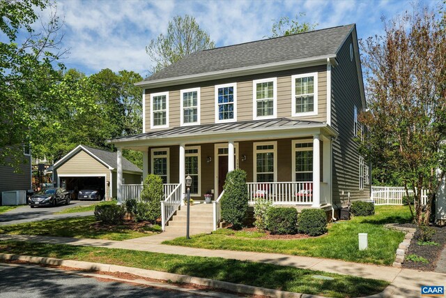 1664 Wickham Way, Charlottesville, VA 22901 - colonial-style house featuring a standing seam roof, covered porch, a garage, metal roof, and fence