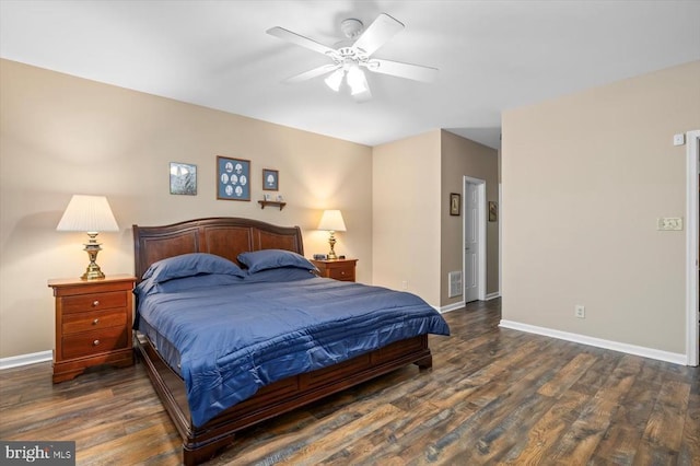 bedroom featuring wood finished floors, baseboards, and ceiling fan
