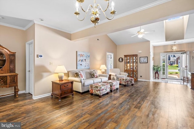 living area with a chandelier, hardwood / wood-style flooring, baseboards, lofted ceiling, and ornamental molding