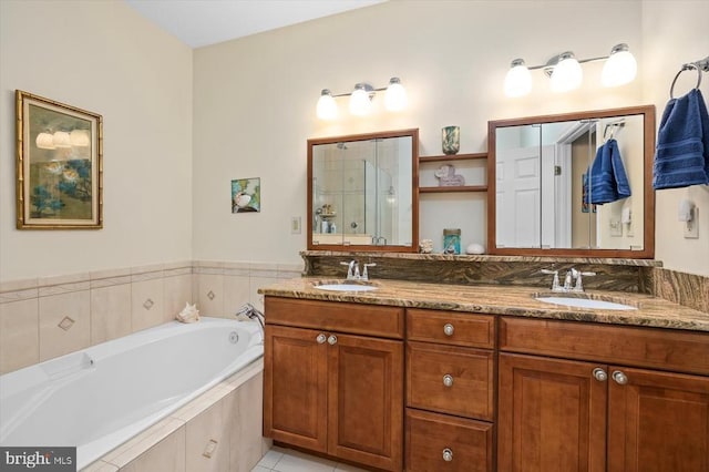 full bathroom featuring a shower stall, a garden tub, double vanity, and tile patterned floors