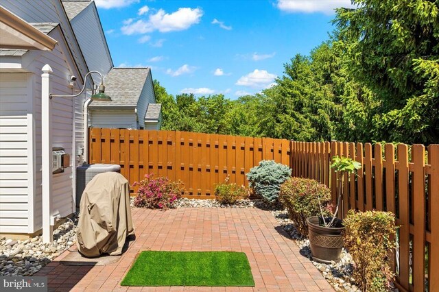view of patio / terrace featuring fence and cooling unit