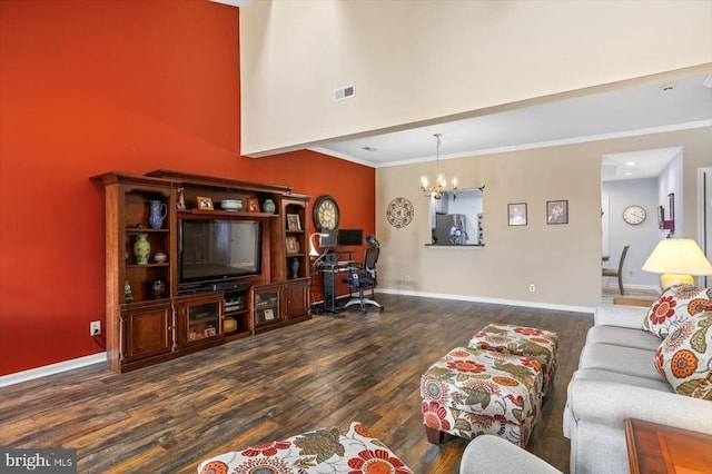 living room featuring dark wood-style floors, a chandelier, an office area, a towering ceiling, and baseboards
