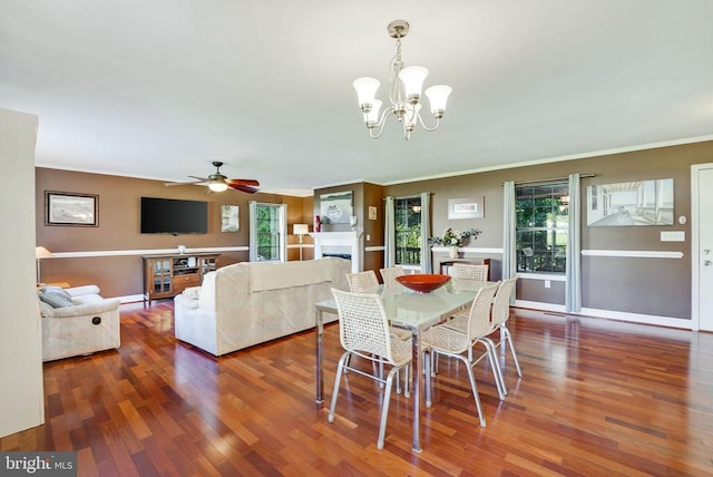 15605 Cedar Tree Ct, Mineral, VA 23117 - dining area featuring wood finished floors, ceiling fan, crown molding, a chandelier, and a fireplace