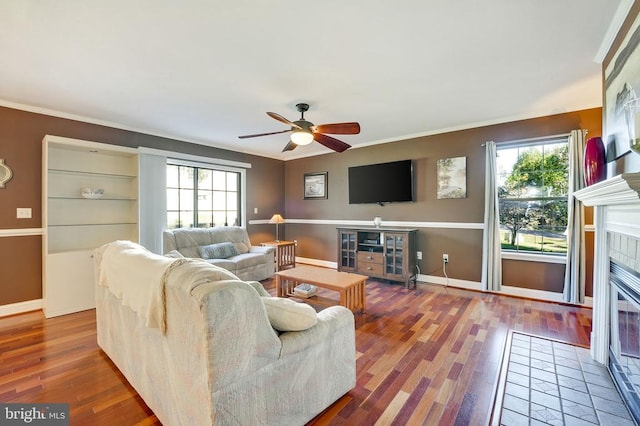 15605 Cedar Tree Ct, Mineral, VA 23117 - living area featuring wood finished floors, ceiling fan, a fireplace, and crown molding