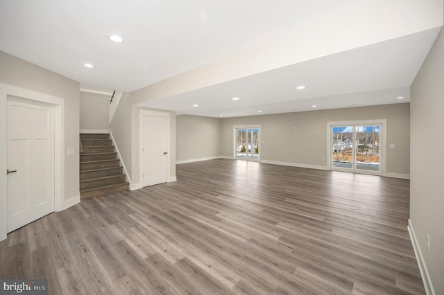 573 Sunset Loop, Mineral, VA 23117 - unfurnished living room with stairway, wood finished floors, and recessed lighting
