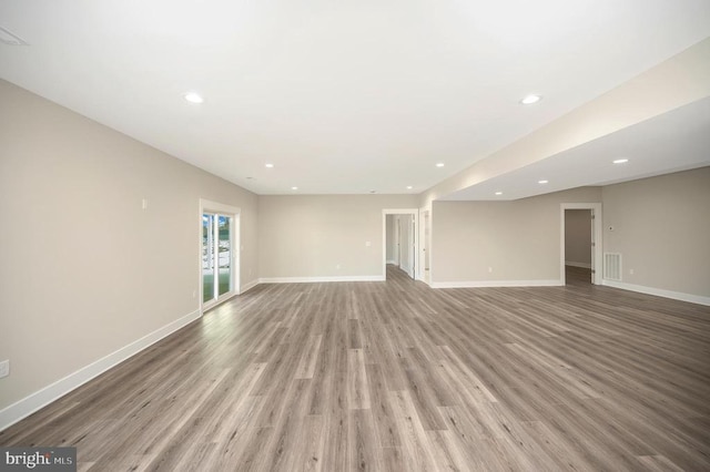 573 Sunset Loop, Mineral, VA 23117 - unfurnished living room featuring wood finished floors and recessed lighting