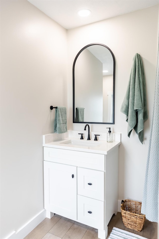 519 Arpia St, Lexington, VA 24450 - bathroom with vanity, baseboards, and wood finished floors