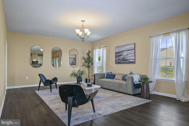 9105 Wild Spruce Dr, Fredericksburg, VA 22407 - living area with a chandelier, baseboards, and dark wood-type flooring
