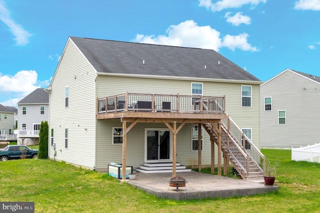 9105 Wild Spruce Dr, Fredericksburg, VA 22407 - back of house featuring a wooden deck, a patio, a lawn, and a fire pit