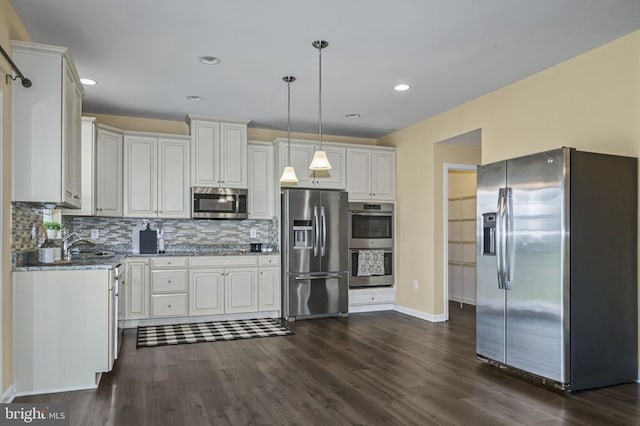 9105 Wild Spruce Dr, Fredericksburg, VA 22407 - kitchen with stainless steel appliances, dark wood-type flooring, hanging light fixtures, backsplash, and recessed lighting