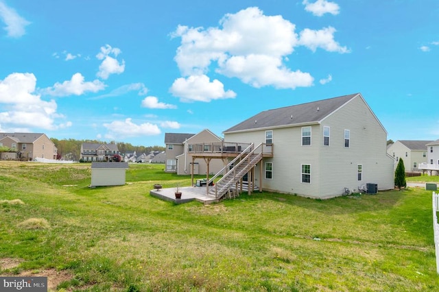 9105 Wild Spruce Dr, Fredericksburg, VA 22407 - back of house with a wooden deck, stairway, a residential view, a yard, and central AC unit