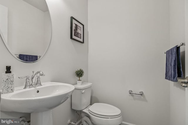 9105 Wild Spruce Dr, Fredericksburg, VA 22407 - half bathroom with toilet, a sink, and baseboards
