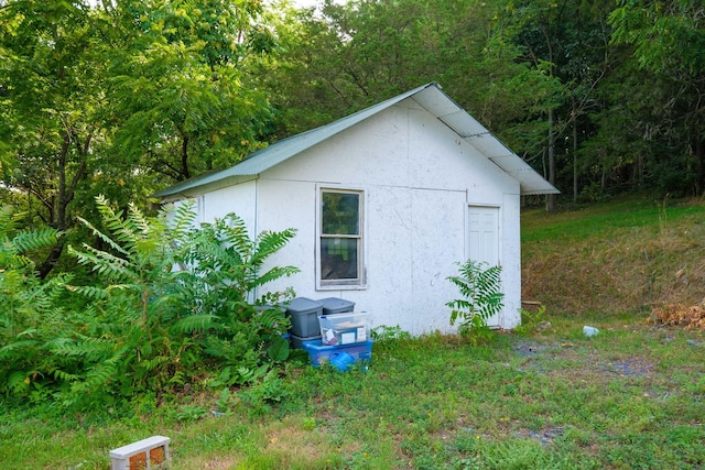 2732 Mountain Valley Rd, Va, VA 22832 - view of property exterior with stucco siding, an outbuilding, and a view of trees