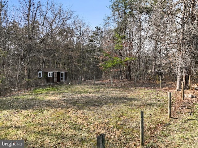 6005 Page Valley Rd, Luray, VA 22835 - view of green lawn with an outdoor structure and a forest view