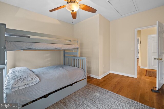 6005 Page Valley Rd, Luray, VA 22835 - bedroom featuring wood finished floors, baseboards, attic access, and a ceiling fan