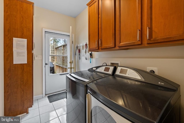 6005 Page Valley Rd, Luray, VA 22835 - washroom featuring separate washer and dryer, cabinet space, light tile patterned floors, and baseboards
