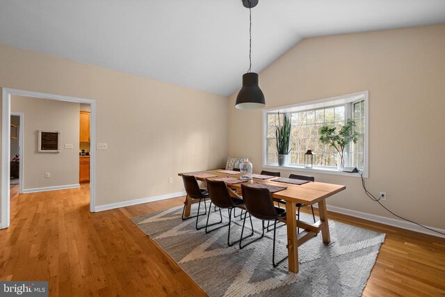 6005 Page Valley Rd, Luray, VA 22835 - dining area with light wood-style floors, vaulted ceiling, and baseboards