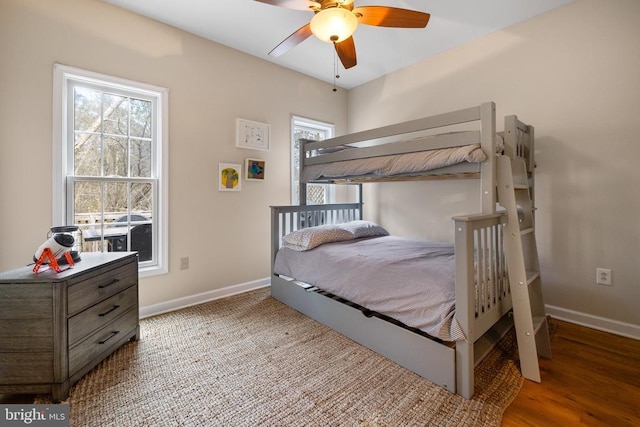 6005 Page Valley Rd, Luray, VA 22835 - bedroom with multiple windows, baseboards, and wood finished floors