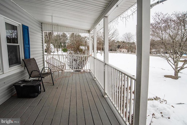 view of snow covered deck