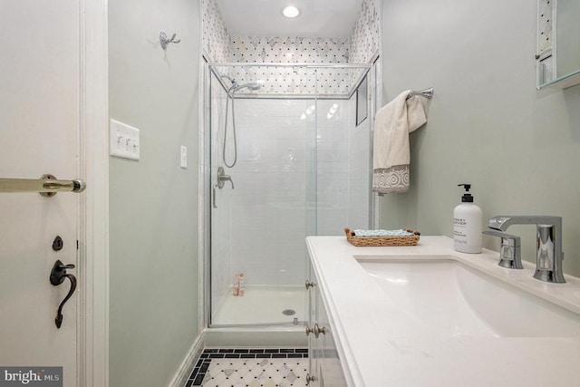bathroom featuring a shower stall, tile patterned floors, baseboards, vanity, and recessed lighting