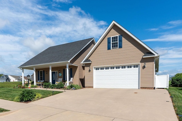 193 Locust Grove Ln, Stuarts Draft, VA 24477 - view of front of property with a porch, a front yard, driveway, and a garage