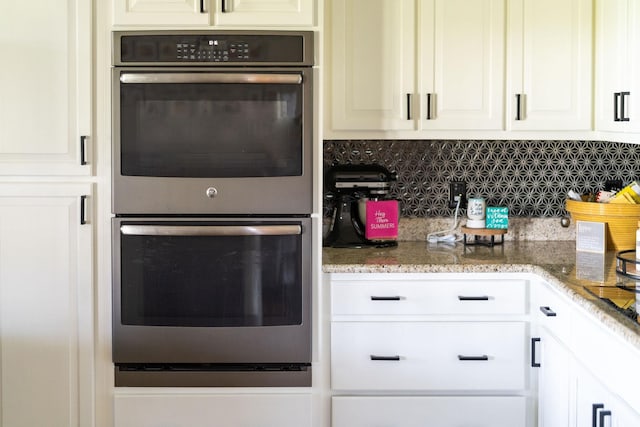 193 Locust Grove Ln, Stuarts Draft, VA 24477 - kitchen with stainless steel double oven, decorative backsplash, white cabinets, and light stone countertops