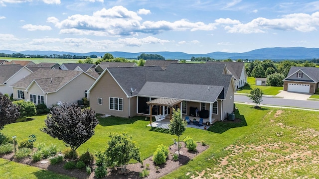 193 Locust Grove Ln, Stuarts Draft, VA 24477 - view of front of house with a patio area, a front yard, a mountain view, a residential view, and a shingled roof