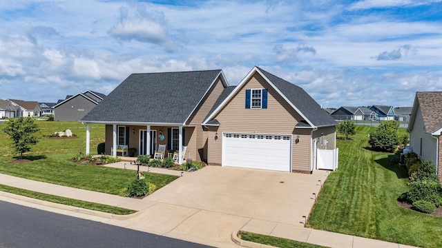 193 Locust Grove Ln, Stuarts Draft, VA 24477 - traditional-style house featuring a porch, driveway, a garage, roof with shingles, and a residential view