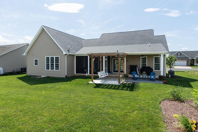 193 Locust Grove Ln, Stuarts Draft, VA 24477 - rear view of house with a lawn, a patio area, and a shingled roof