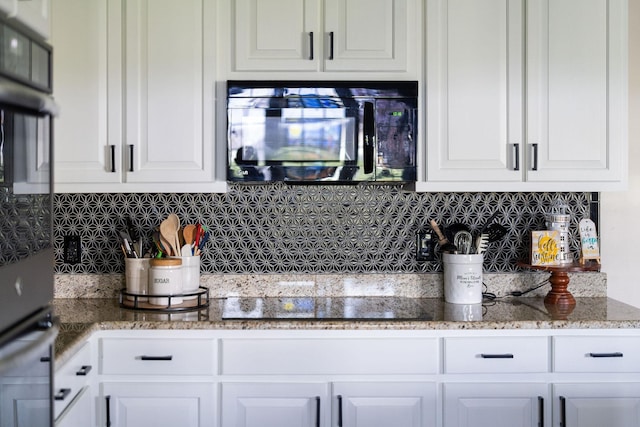 193 Locust Grove Ln, Stuarts Draft, VA 24477 - kitchen featuring black appliances, decorative backsplash, white cabinetry, and light stone counters