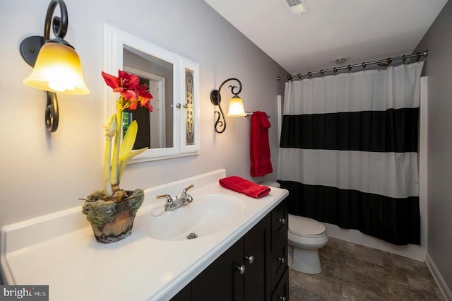 bathroom with vanity, toilet, and a shower with curtain