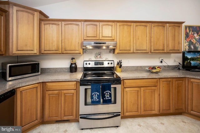 kitchen with stainless steel appliances, under cabinet range hood, and brown cabinets