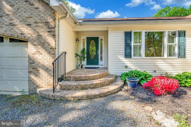 property entrance featuring an attached garage