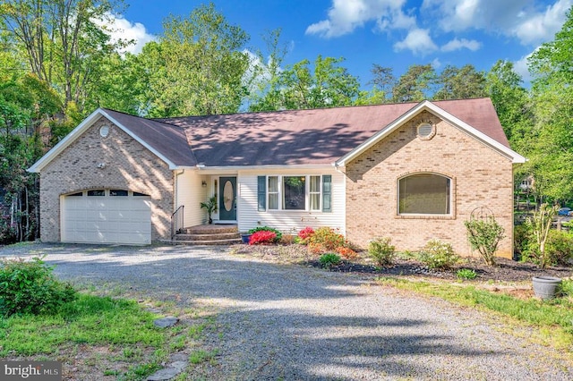 ranch-style house with driveway, brick siding, an attached garage, and roof with shingles