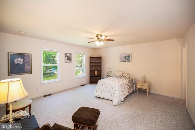 bedroom featuring carpet floors, baseboards, and a ceiling fan