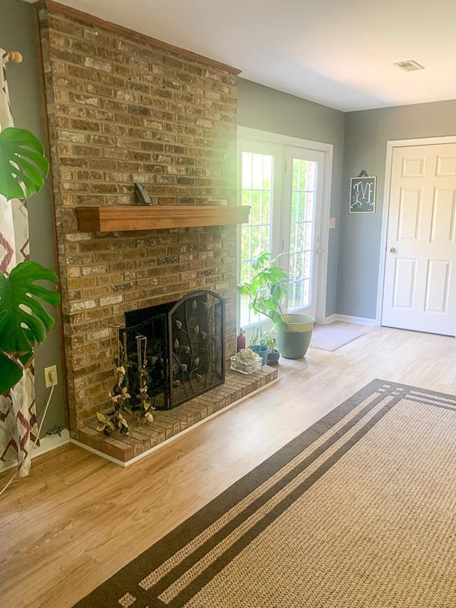 209 Raintree Rd, Verona, VA 24482 - living room with wood finished floors, baseboards, and a fireplace