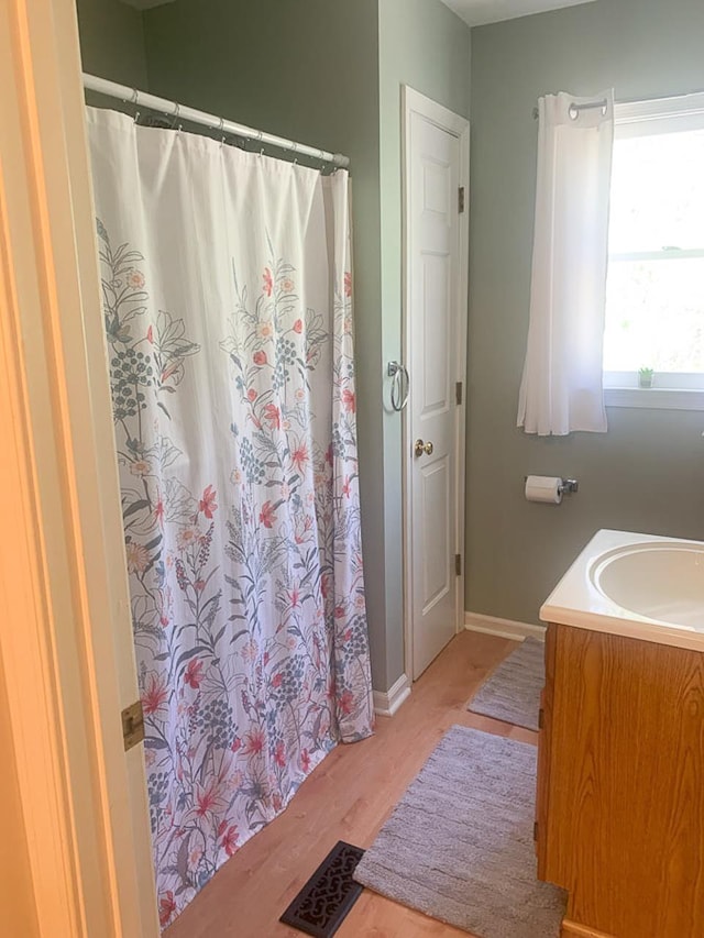 209 Raintree Rd, Verona, VA 24482 - bathroom featuring wood finished floors, baseboards, vanity, and a shower with shower curtain
