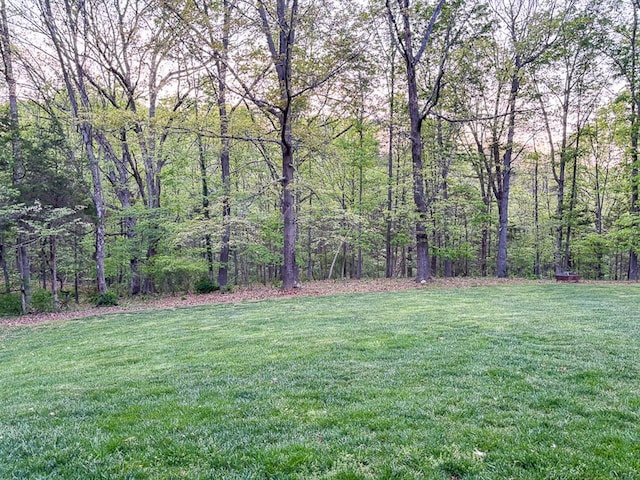 209 Raintree Rd, Verona, VA 24482 - view of grassy yard featuring a wooded view
