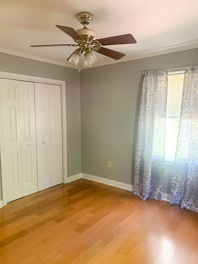209 Raintree Rd, Verona, VA 24482 - unfurnished bedroom with light wood-style floors, ornamental molding, a closet, baseboards, and a ceiling fan