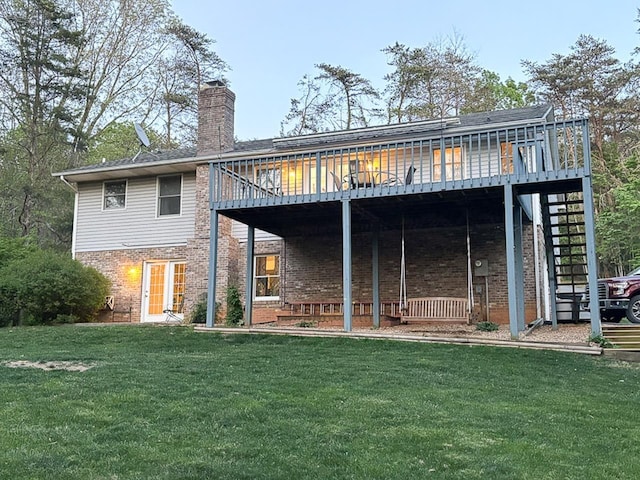 209 Raintree Rd, Verona, VA 24482 - rear view of property featuring brick siding, a yard, a chimney, and a deck
