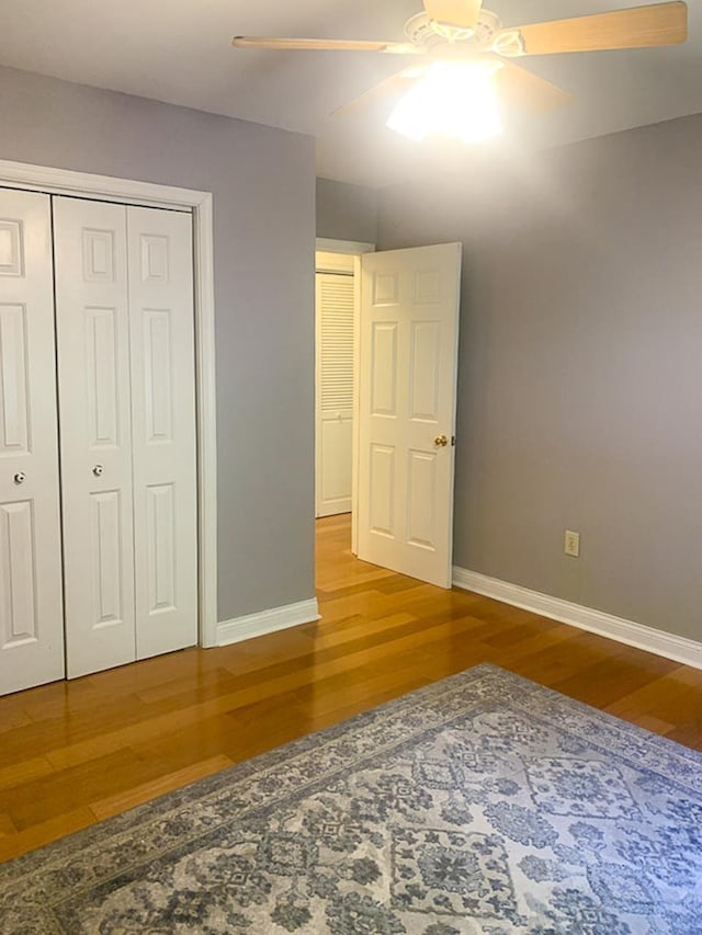 209 Raintree Rd, Verona, VA 24482 - unfurnished bedroom with wood finished floors, baseboards, a closet, and a ceiling fan