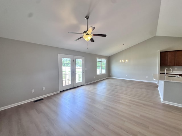 70 Spring Ridge Ln, Fairfield, VA 24435 - unfurnished living room featuring ceiling fan, a chandelier, vaulted ceiling, and light wood finished floors