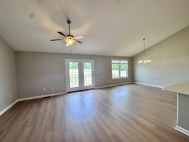 70 Spring Ridge Ln, Fairfield, VA 24435 - unfurnished living room with vaulted ceiling, wood finished floors, a ceiling fan, and a chandelier