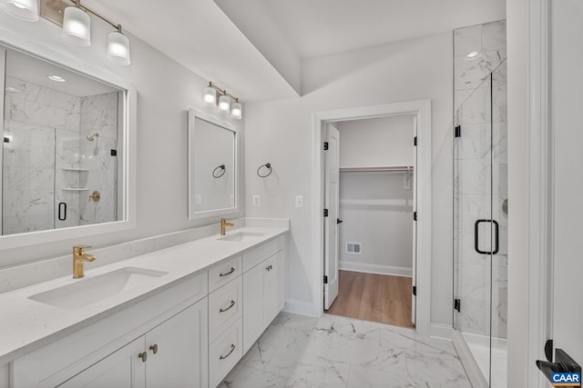 1367 Laconia Ln, Charlottesville, VA 22911 - bathroom with marble look tiles, double vanity, a marble finish shower, and a spacious closet