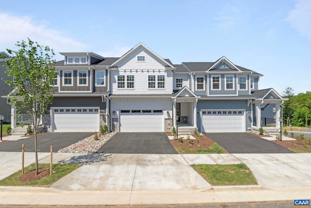 1367 Laconia Ln, Charlottesville, VA 22911 - view of property featuring driveway, a garage, and stone siding