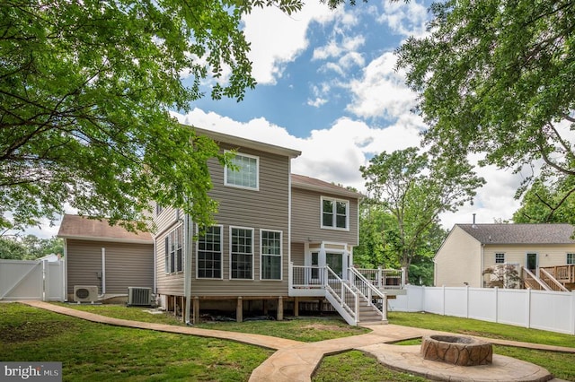 11603 Enchanted Woods Way, Fredericksburg, VA 22407 - rear view of house featuring an outdoor fire pit, stairway, central air condition unit, a deck, and a cooling unit