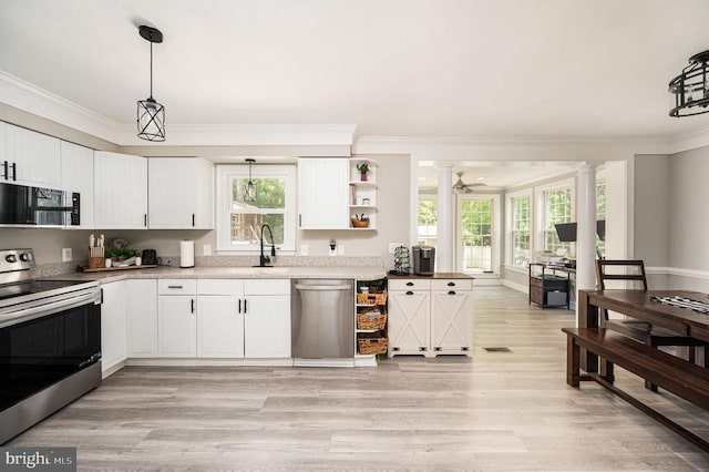 11603 Enchanted Woods Way, Fredericksburg, VA 22407 - kitchen featuring stainless steel appliances, ornamental molding, light wood-type flooring, white cabinets, and hanging light fixtures